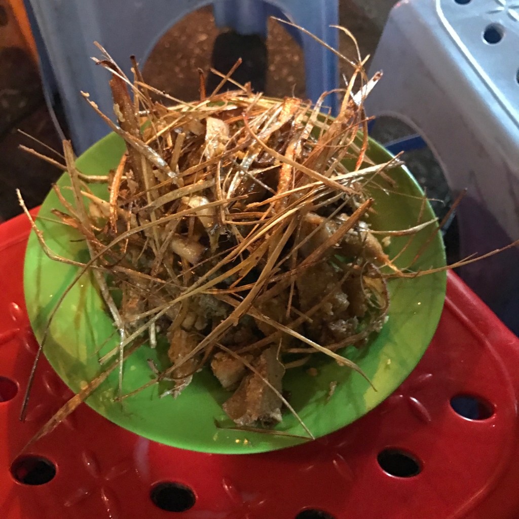 Deep fried chicken cartilage with mysterious sticks of ?lemongrass @ the Bia Hoi Corner