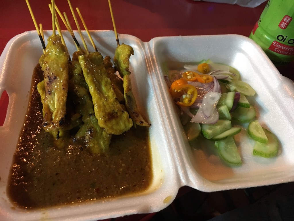 Pork Satay served with peanut sauce and vegetables @ street stall in Chinatown