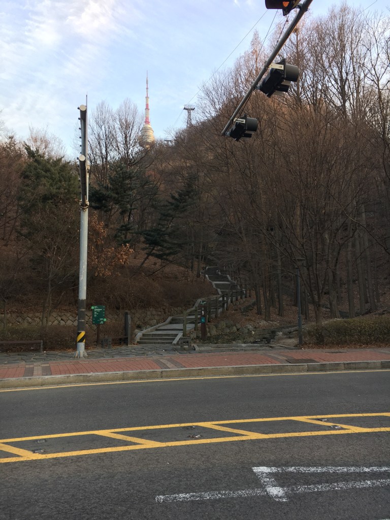 Staircase across from cable car station. You would think that is the way up but it's not.