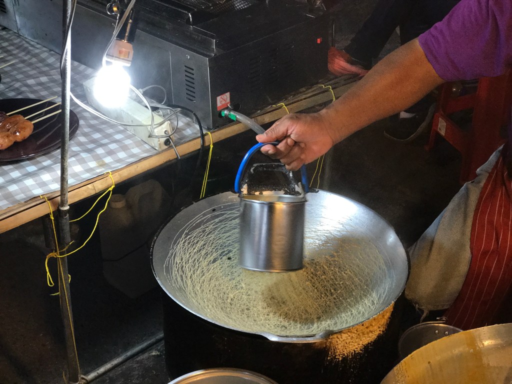 The making of the nest-like desserts @ The Sunday Night Market. Photo credit: Aaron.