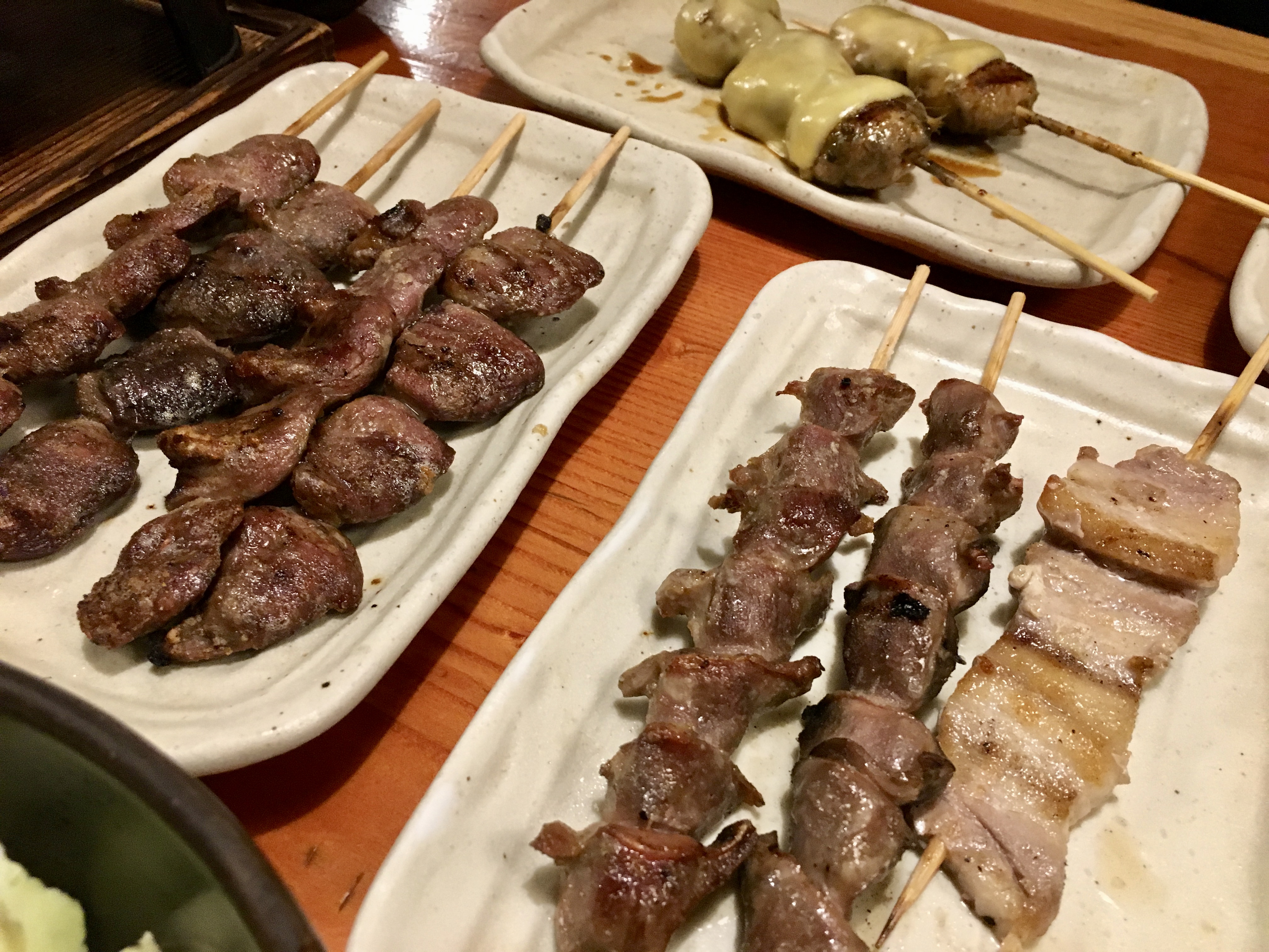 Chicken with cheese, chicken hearts, chicken gizzard, and pork belly @ Torikizoku