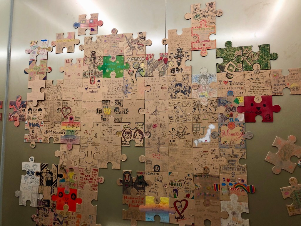 Puzzles pieces in the elevator of Cho Hotel